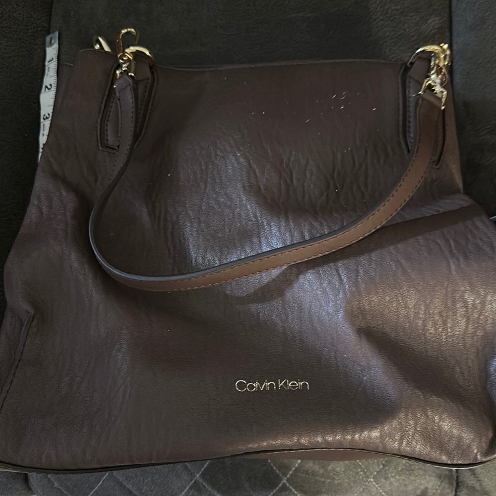 Never used triple compartment Calvin Klein purse